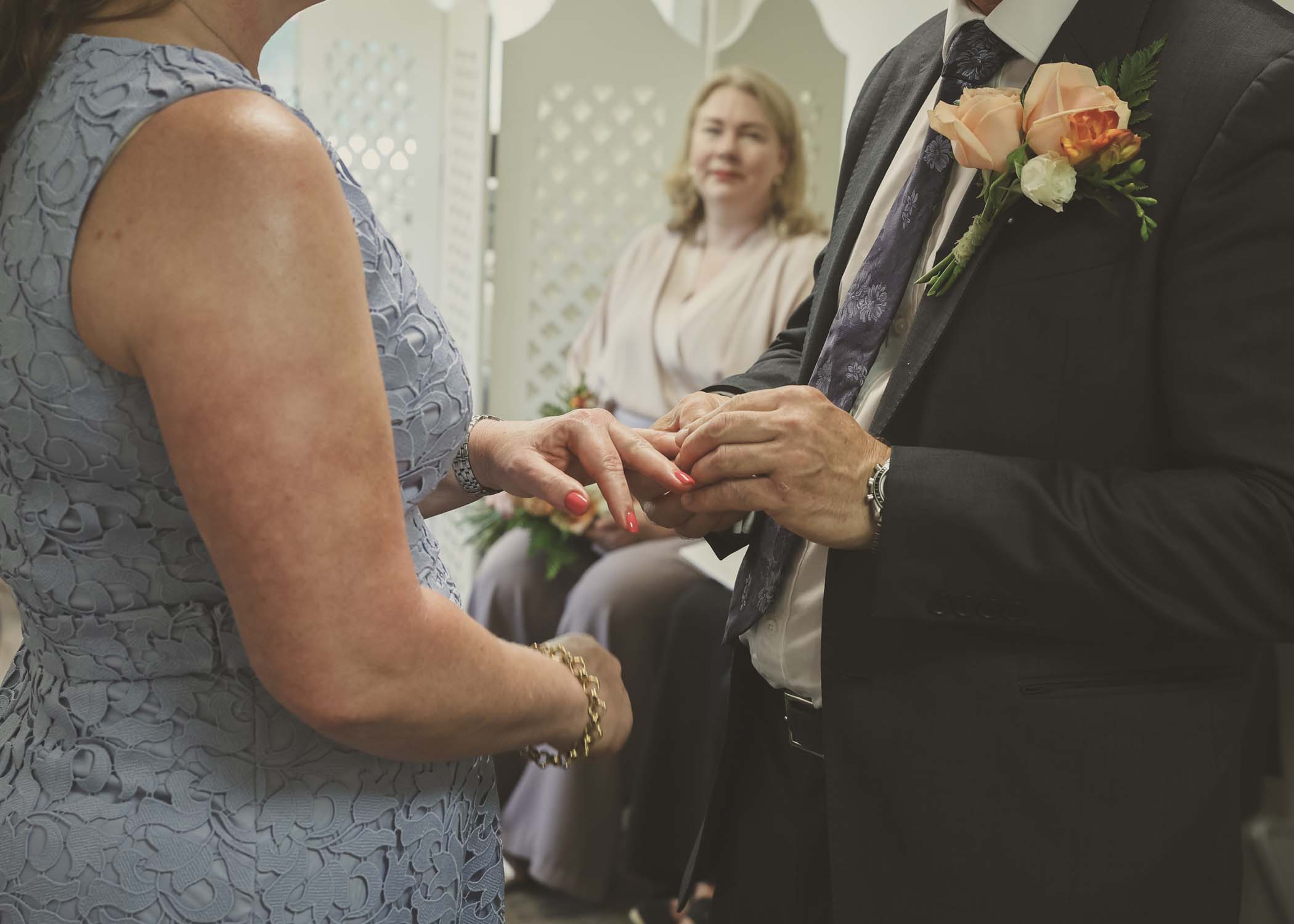 A close up of a ring exchange at woodbridge registry office on a wedding day in Woodbridge captured by Suffolk Wedding Photographer Hayley Denston Photography